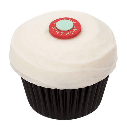 Classic Red Velvet cupcake with smooth cream cheese frosting, birthday-themed dot decoration, and a natural beeswax candle for celebrating.